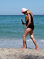 nordic woman walking at southern mediterrean sea